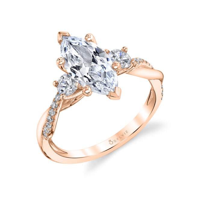 marquise shaped 3 stone engagement ring in rose gold