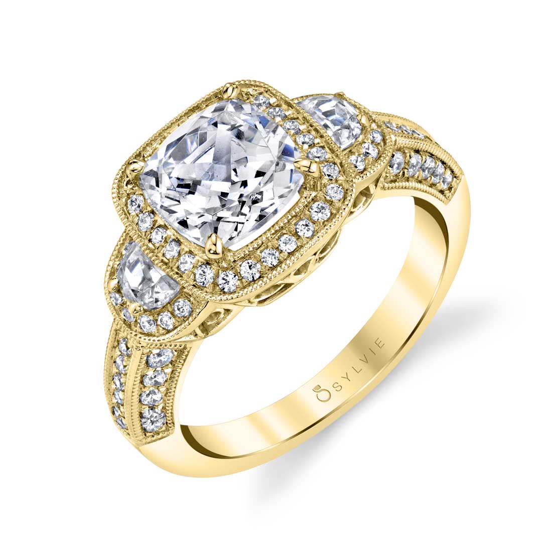 three stone cushion cut engagement ring in yellow gold