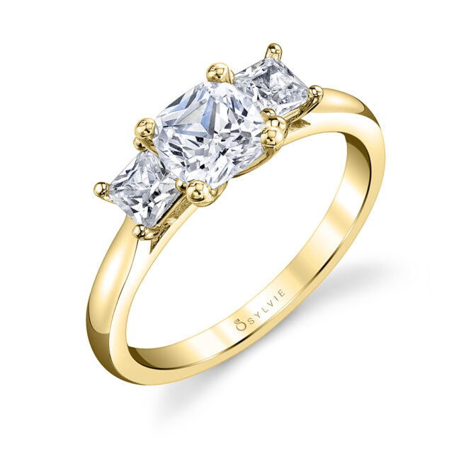 3 stone cushion cut engagement ring in yellow gold