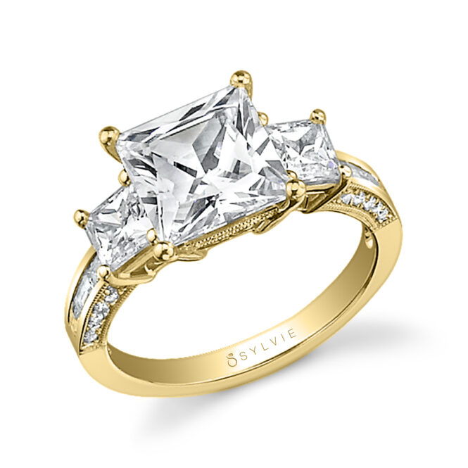 princess cut engagement ring with princess side stones in yellow gold