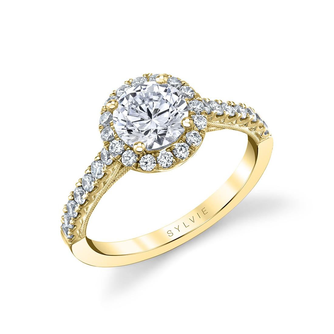 modern halo engagement ring in yellow gold