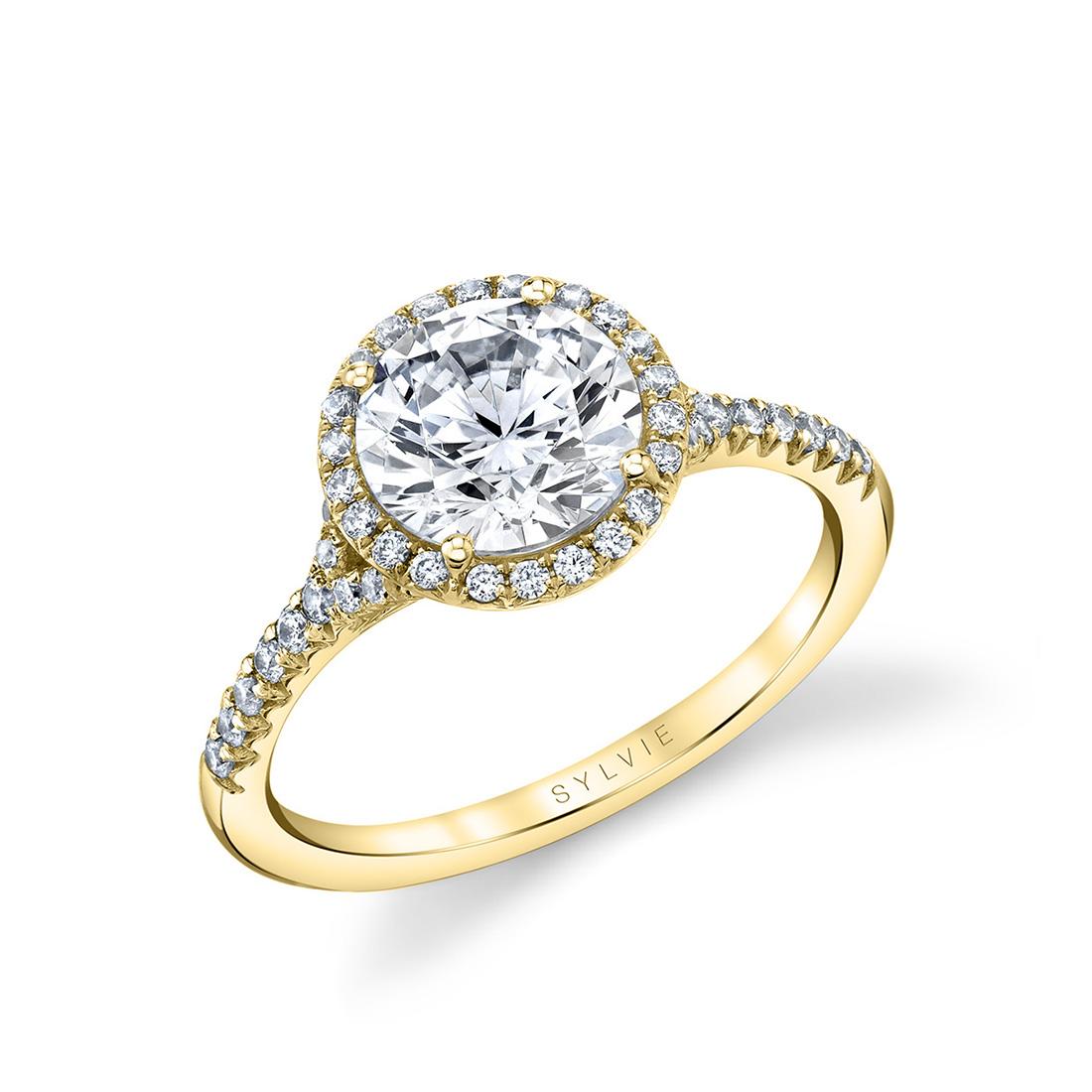 modern halo engagement ring with split shank in yellow gold