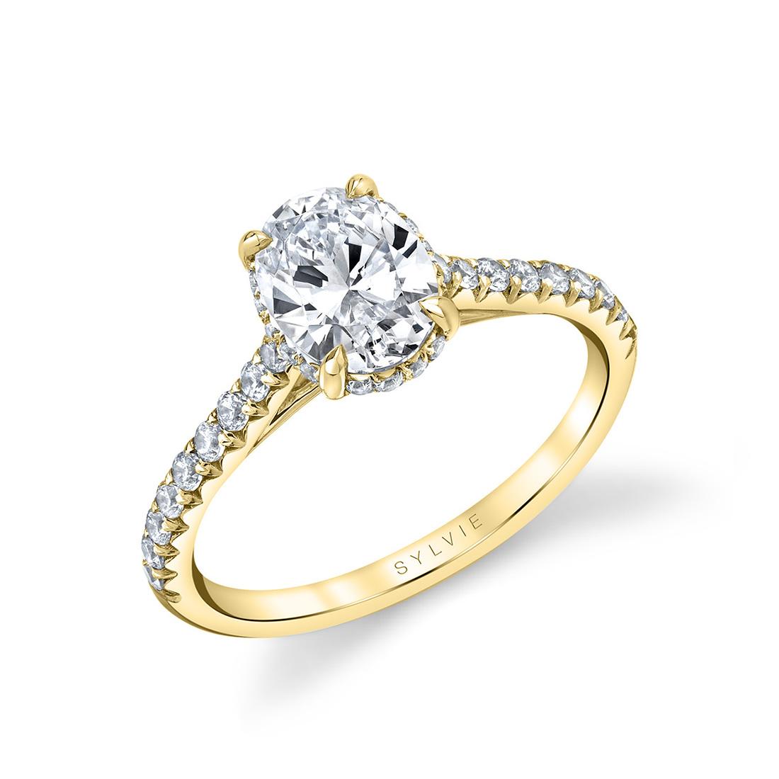 oval engagement ring with hidden halo in yellow gold