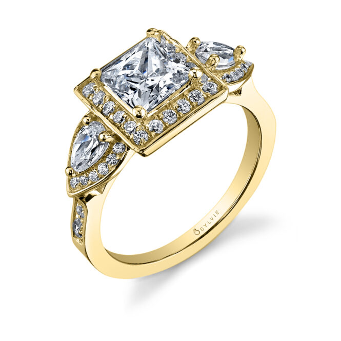 princess cut halo engagement ring with pear side stones in yellow gold