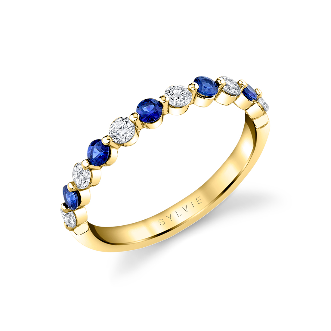 blue sapphire and diamond wedding band in yellow gold