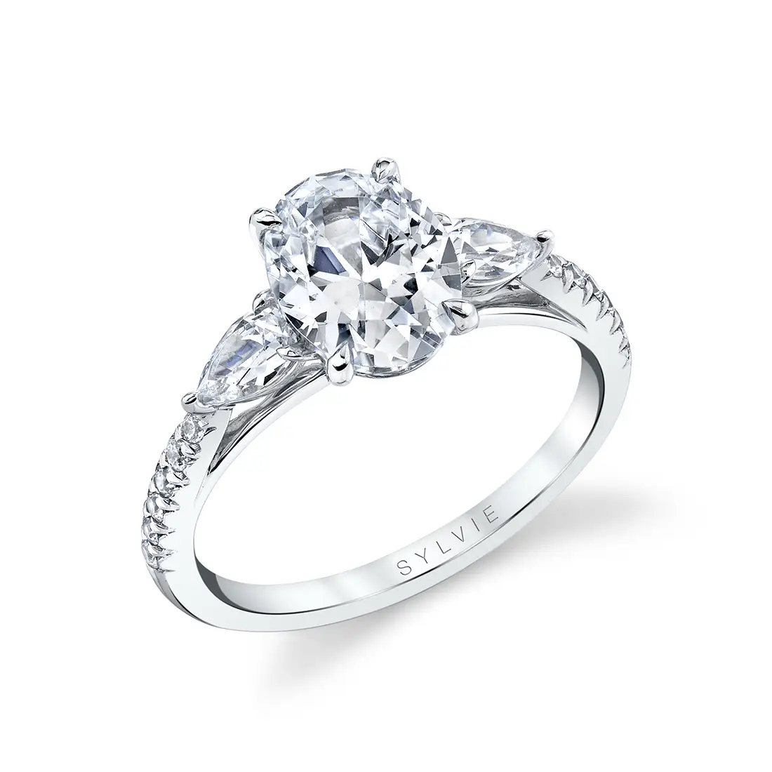 oval engagement ring with pear side stones